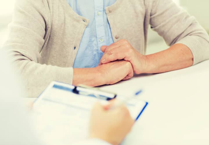 Doctor reviewing alzheimer's memory test with patient