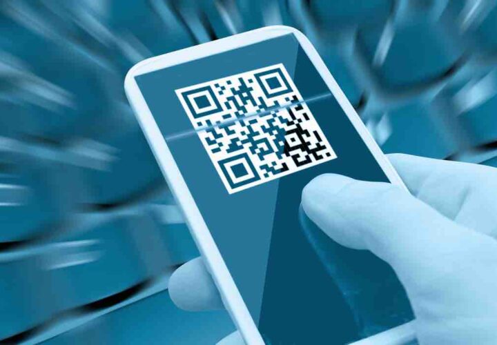 Reading QR Code With Smartphone in Man's Hand