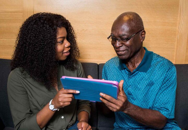 woman and her father using my house of memories app for dementia