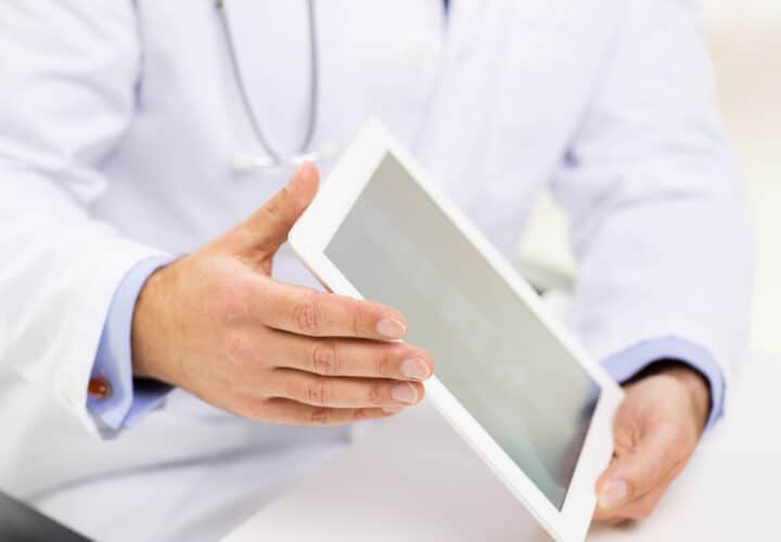 doctor holding electronic tablet in hands