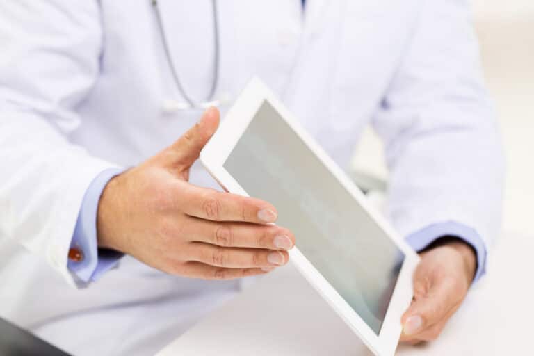 doctor holding electronic tablet in hands