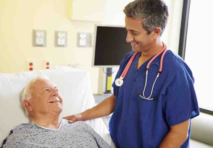 Male Doctor Talking With Senior Male Patient