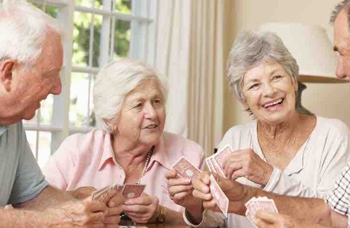 group of seniors playing card game