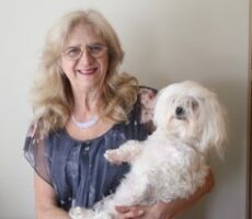 Blogger Laurie Scherrer with her adorable white dog