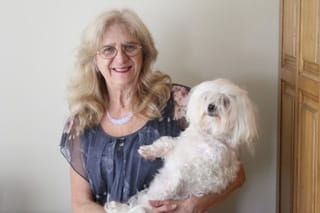 Blogger Laurie Scherrer with her adorable white dog